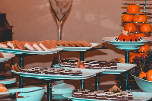 A beautifully arranged table with an assortment of healthy desserts and fresh fruits.