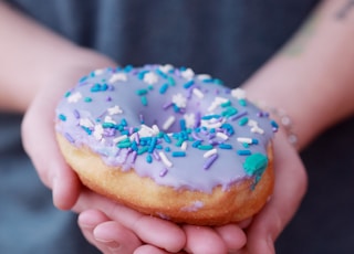 person holding doughnut