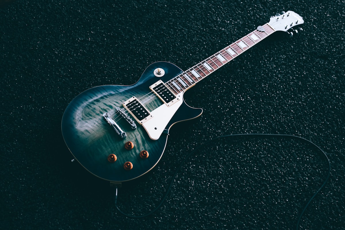 An electric guitar being set up