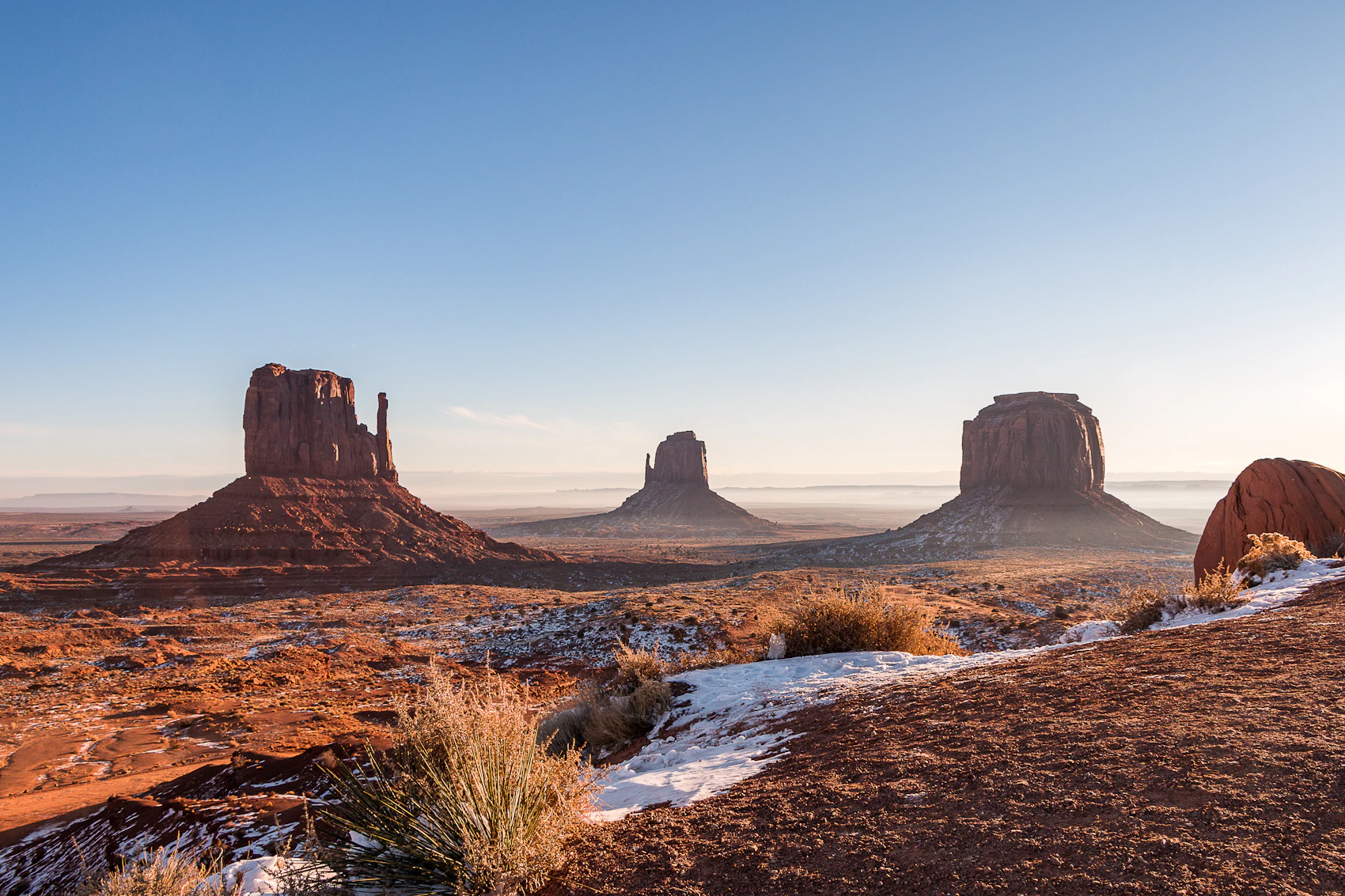 The sandstone buttes of Monument Valley in early light