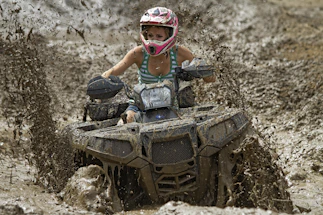 woman riding on off-road ATV
