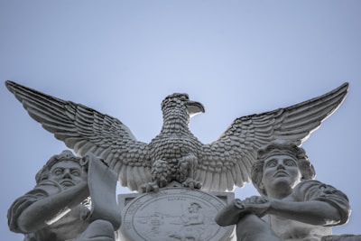 A smiling customer holding a personalized eagle-themed artwork from on eagles wings llc.