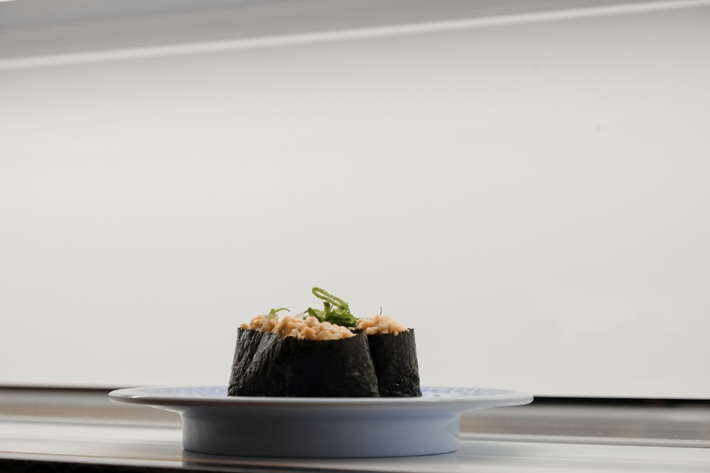 sushi served on white ceramic saucer