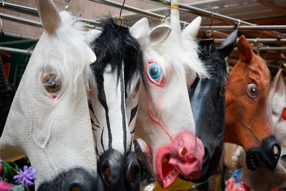 several animal head masks hanging closeup photography