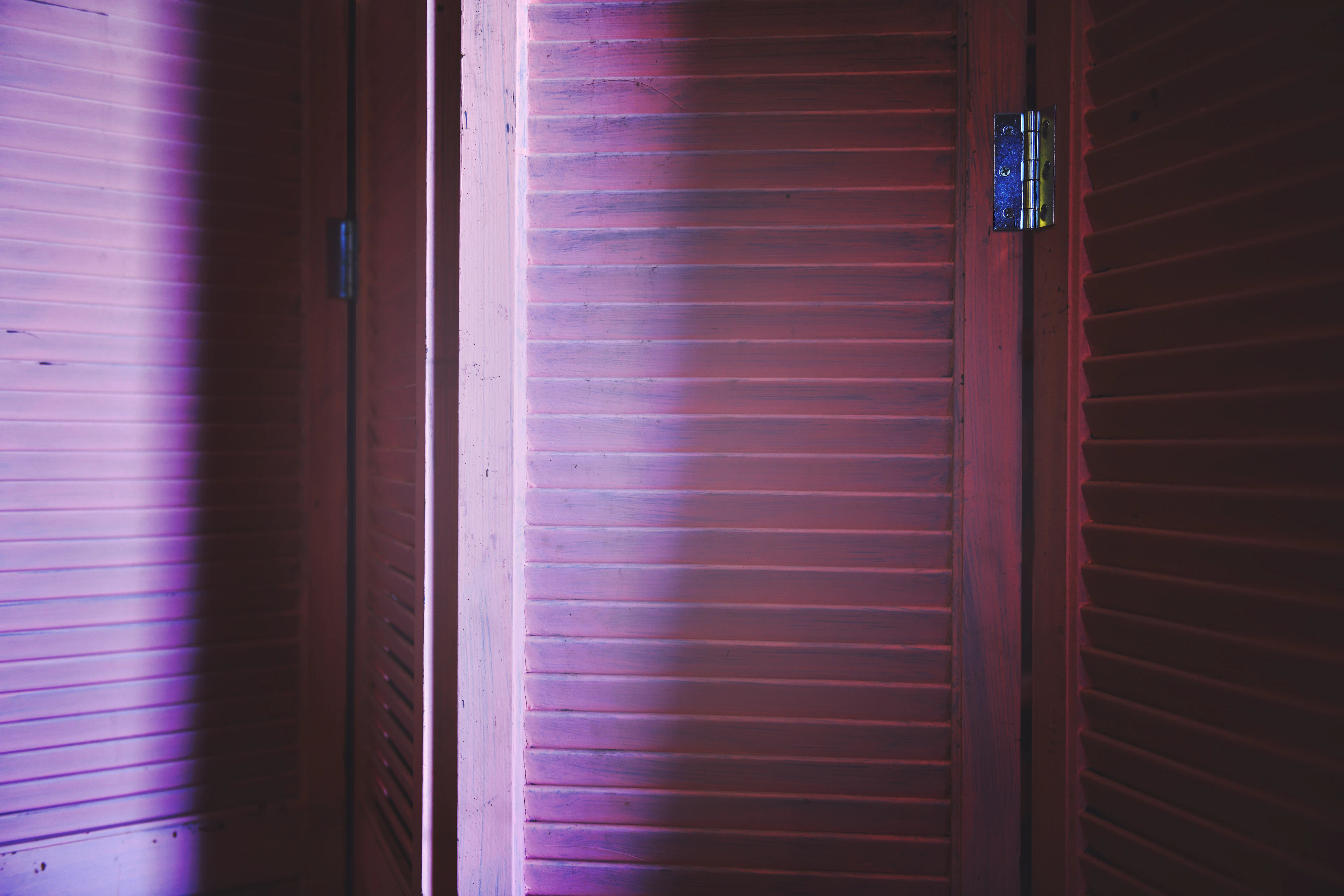 Elegant slim wooden room divider panels in a light space