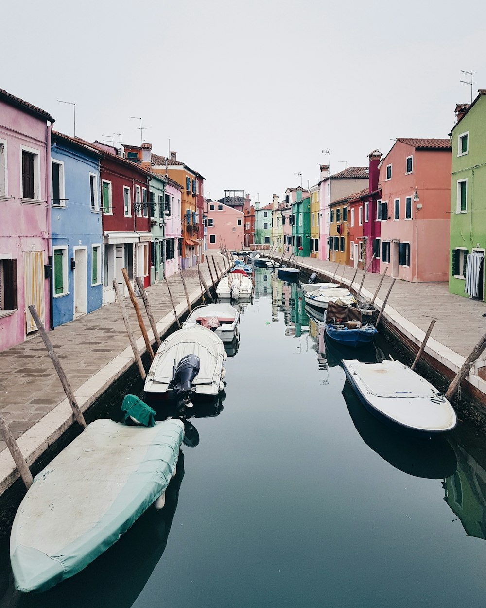 fishing boats between houses