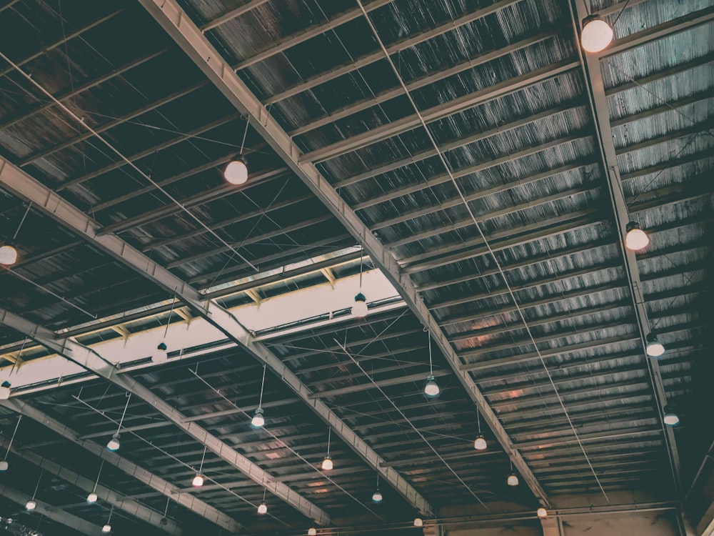 gray metal framed ceiling with pendant lamps