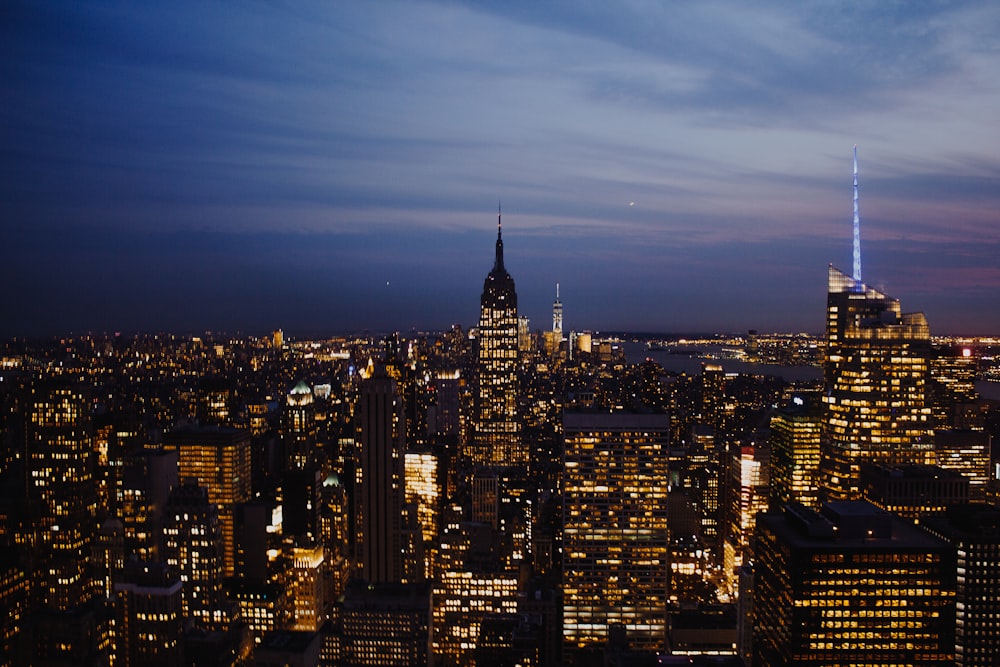 top view photography of city with high-rise buildings at nighttime