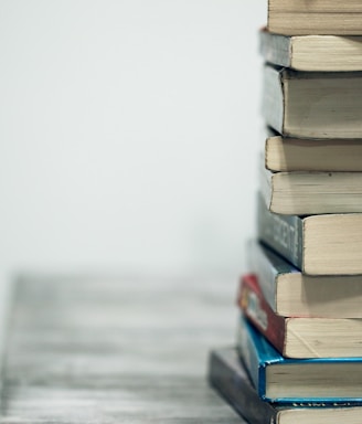 assorted books on wooden table