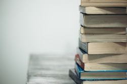 assorted books on wooden table