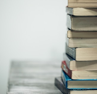 assorted books on wooden table