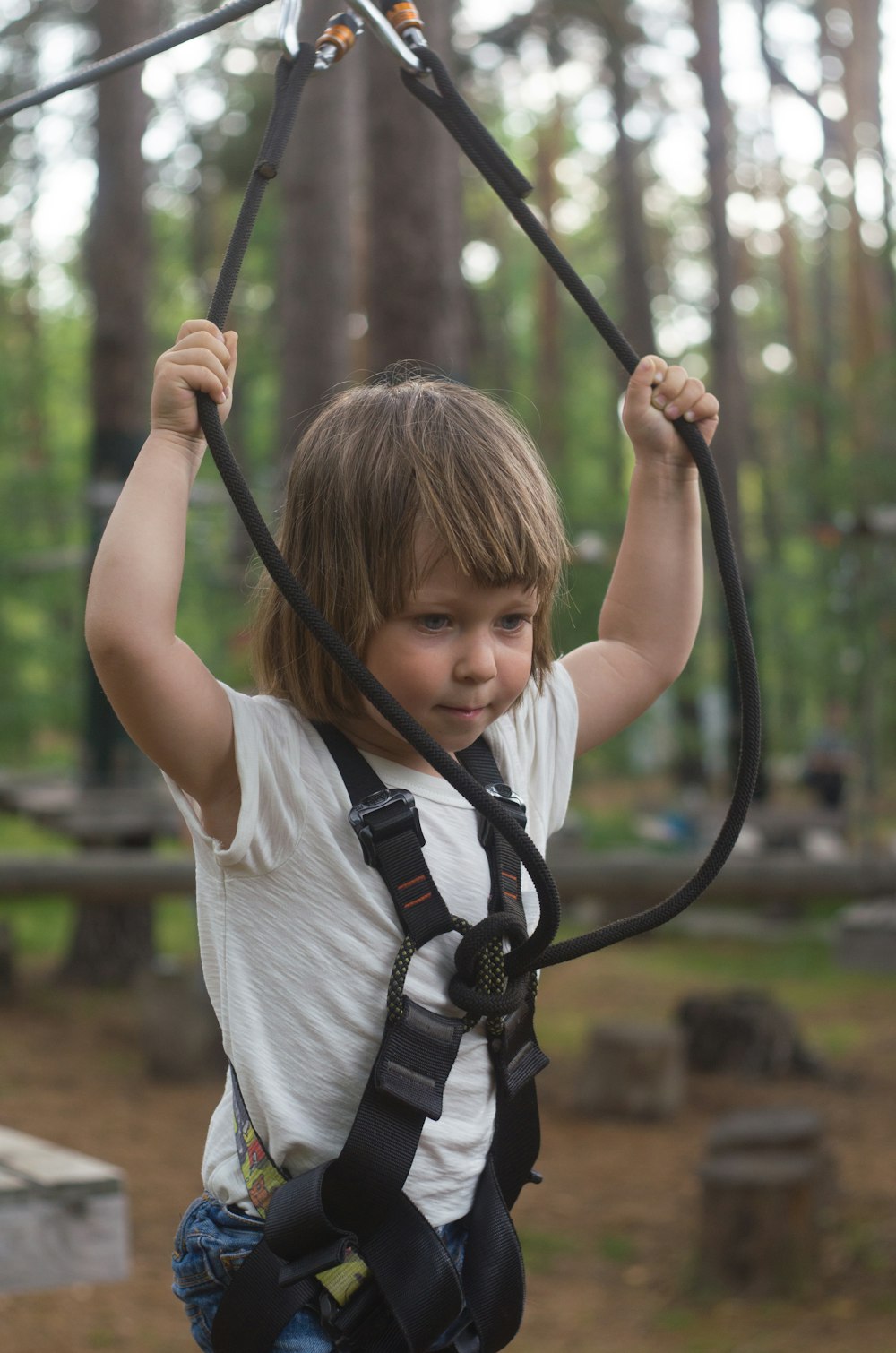 toddler riding on harness