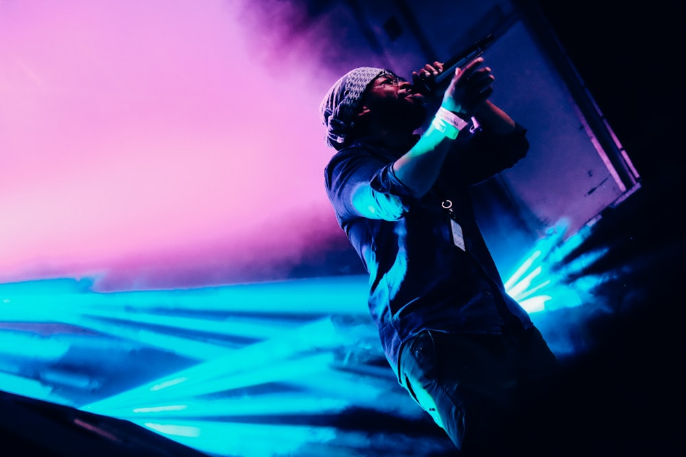 man holding wireless microphone