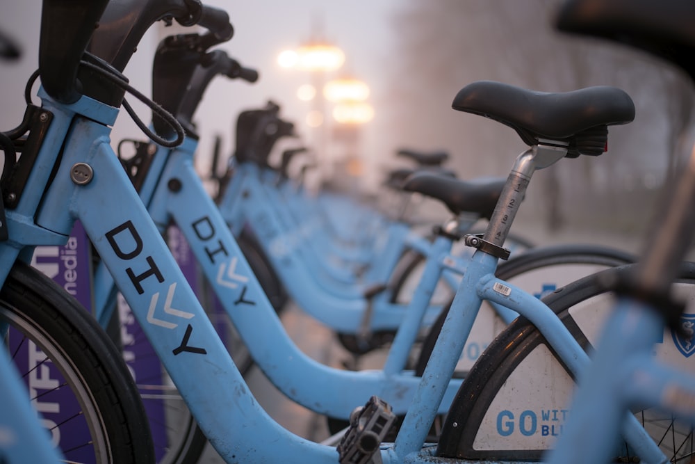 blue step-through bicycles in tilt shift photography