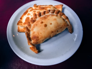 Golden risoles arranged neatly on a serving plate.