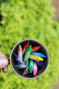 flat lay photography of crayons inside mug