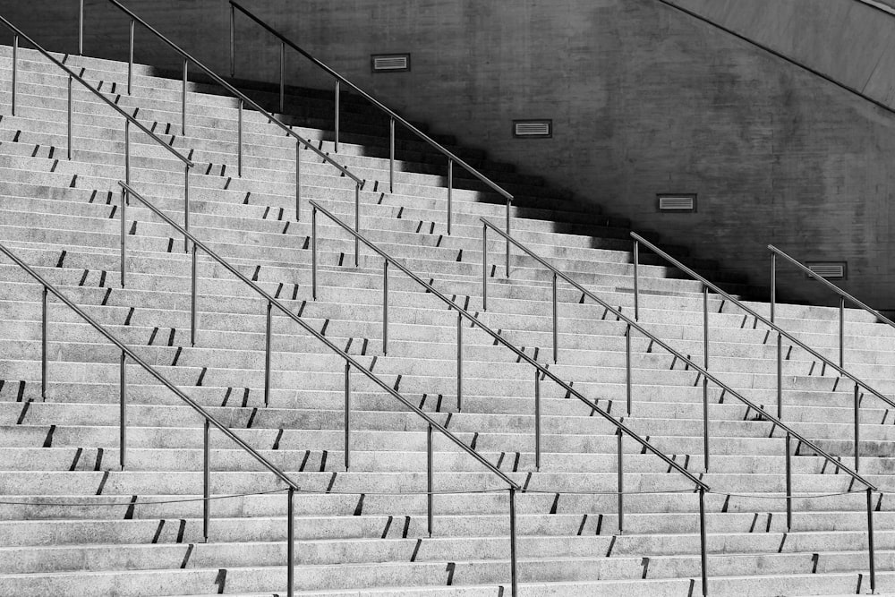 gray metal railings on white staircase