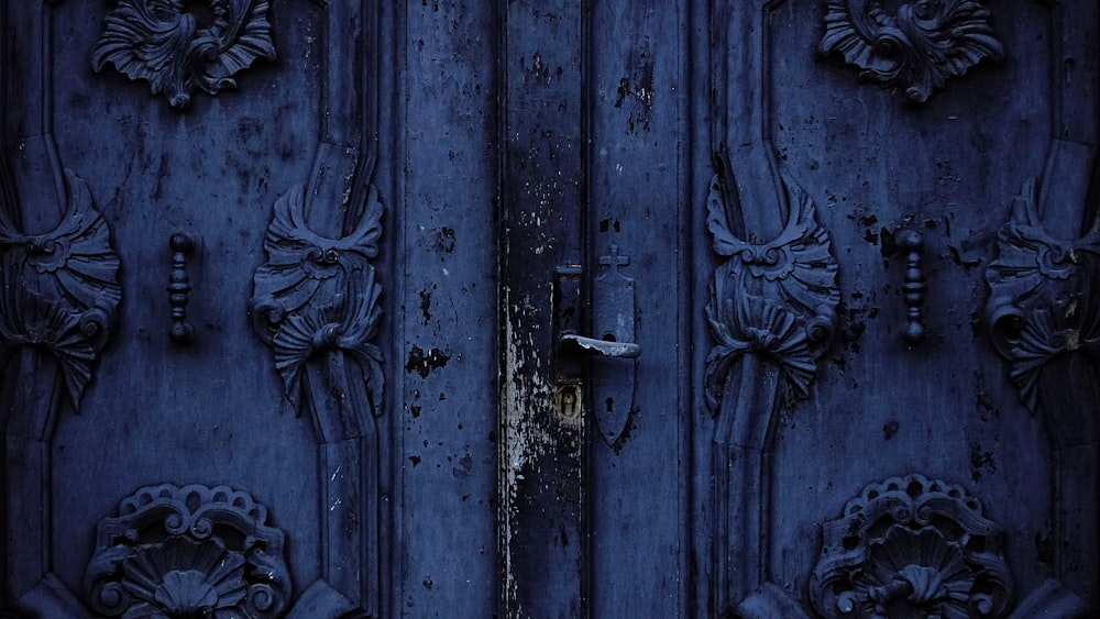 blue wooden ornate embossed door