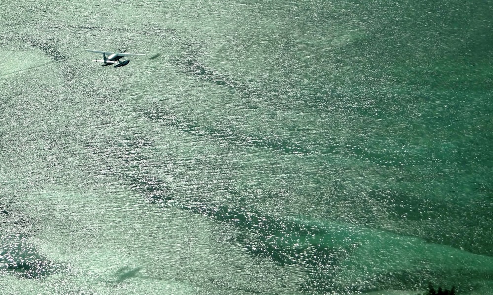 seaplane flying above water