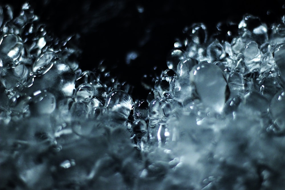 a close up of water bubbles on a black background