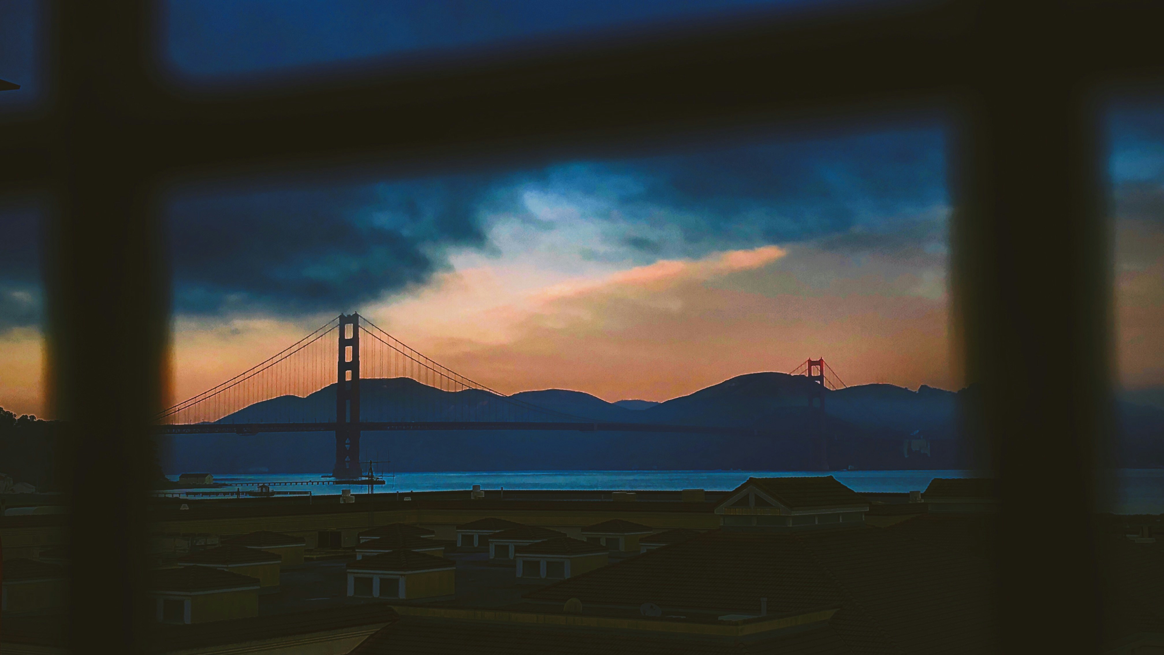 landscape view photo of cable bridge under dark sky