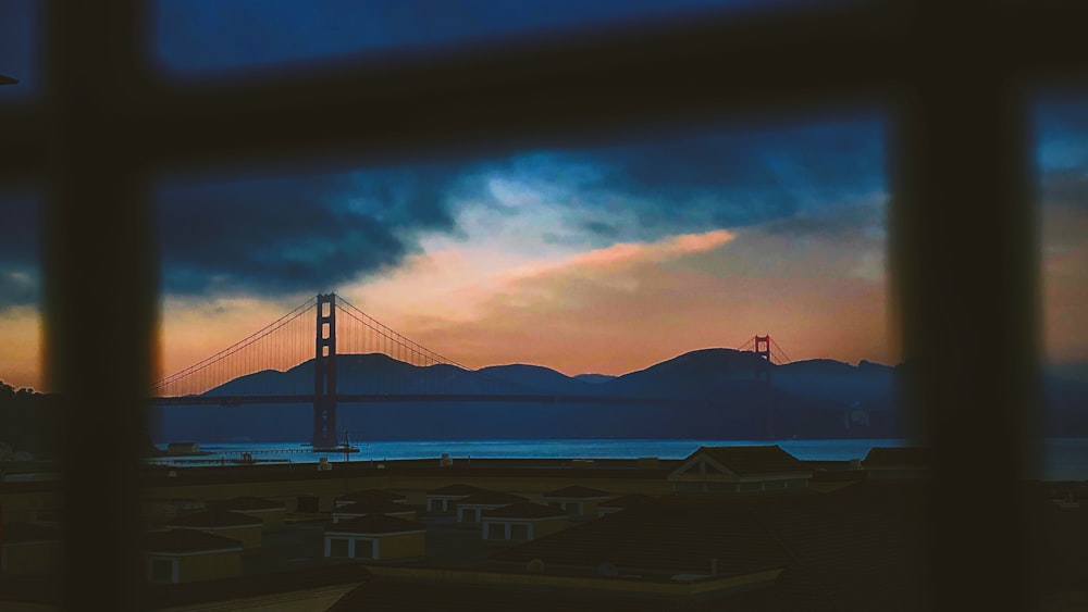 landscape view photo of cable bridge under dark sky