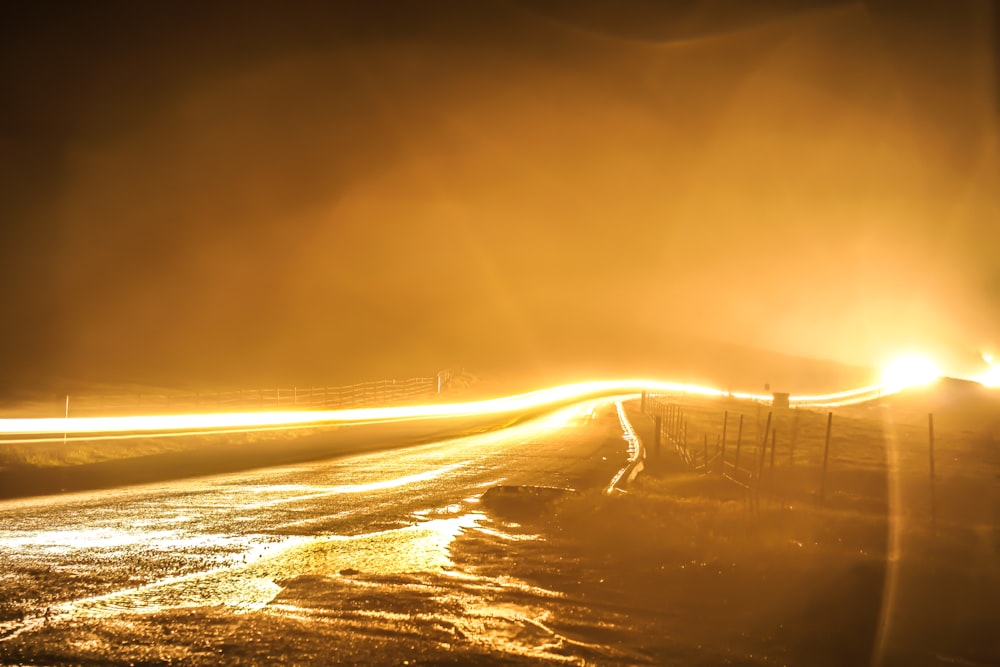 a long exposure photo of a street at night