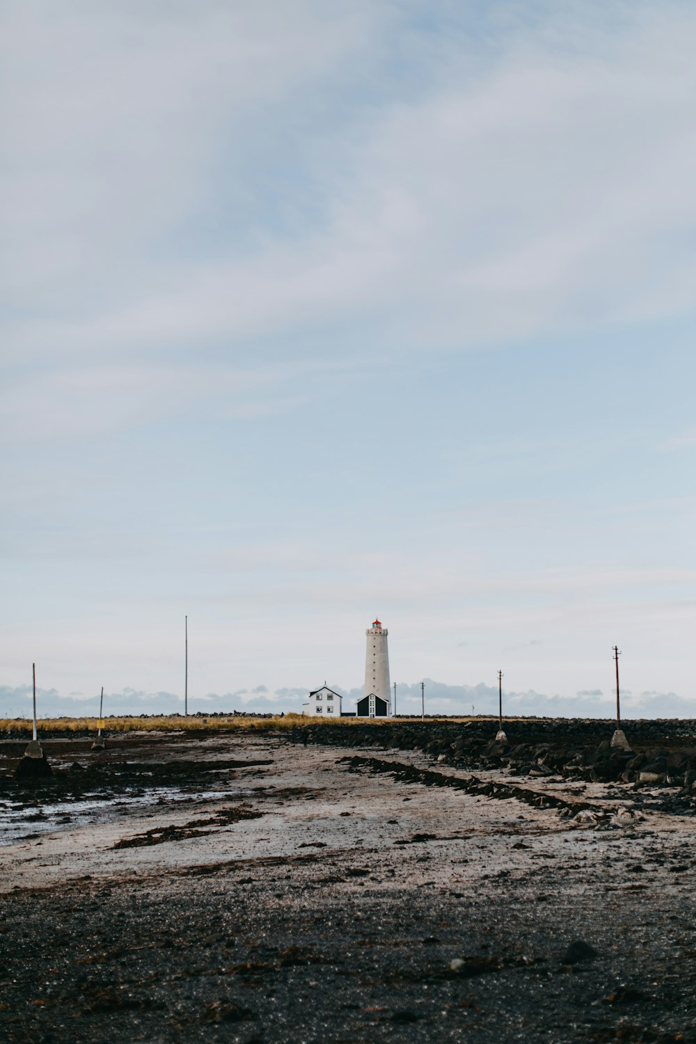 white concrete lighthouse under sky