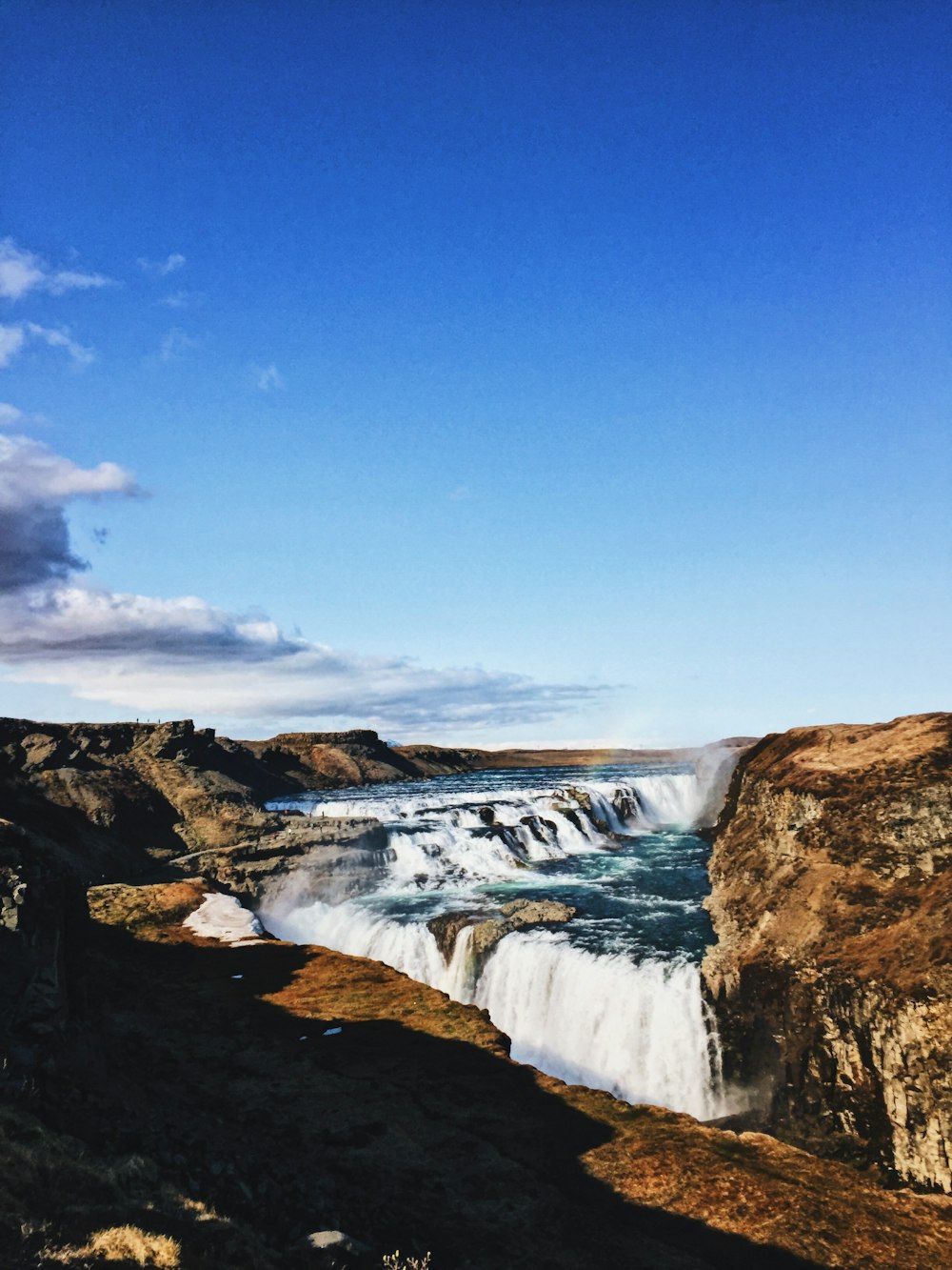 landscape photography of waterfalls with mountain