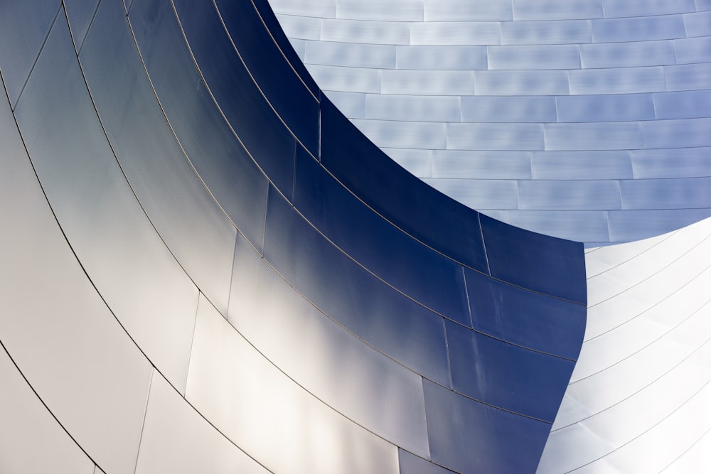 a close up of a building with a curved wall