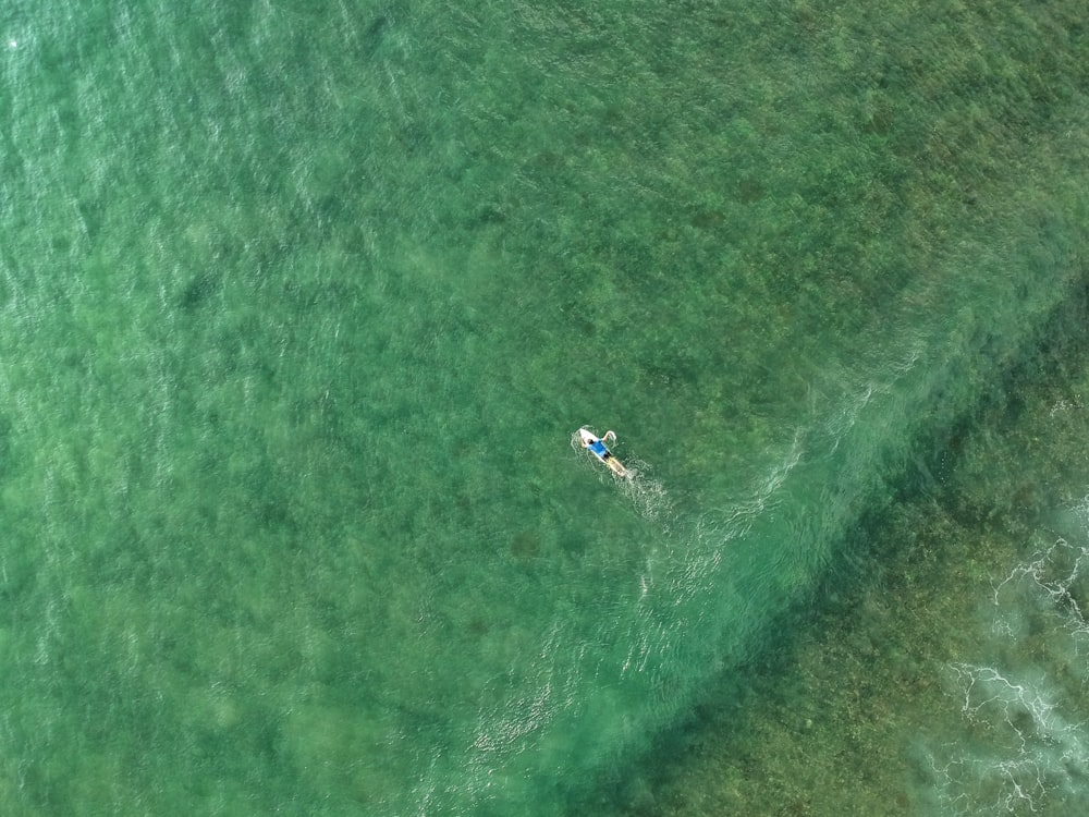aerial photography of person on kayak