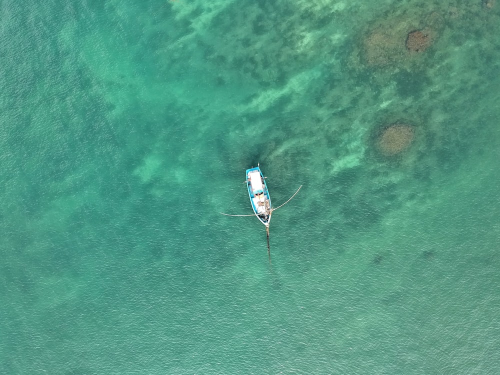 white boat on ocean water
