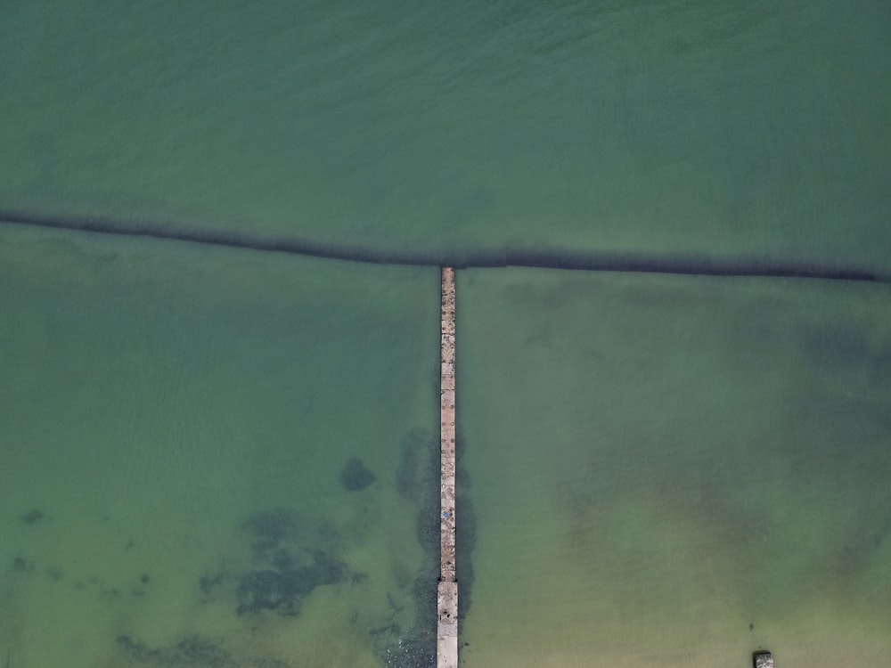 aerial photograph of sea and bridge