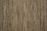 A close-up view of a bamboo mat with thin, vertical bamboo sticks aligned closely together, bound by strings horizontally at intervals.