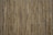 A close-up view of a bamboo mat with thin, vertical bamboo sticks aligned closely together, bound by strings horizontally at intervals.