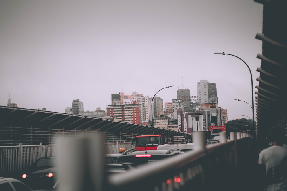 tight traffic in the middle of city during cloudy day