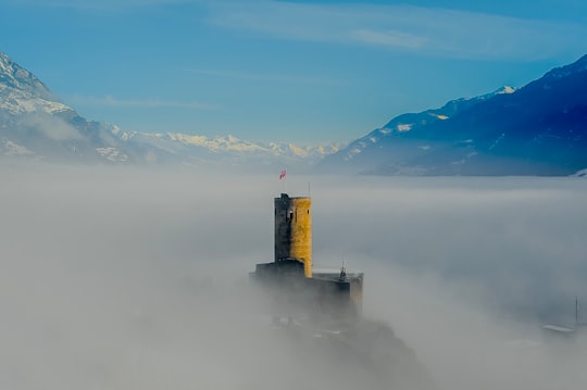 aerial photography of mountains and tower in Martigny Switzerland