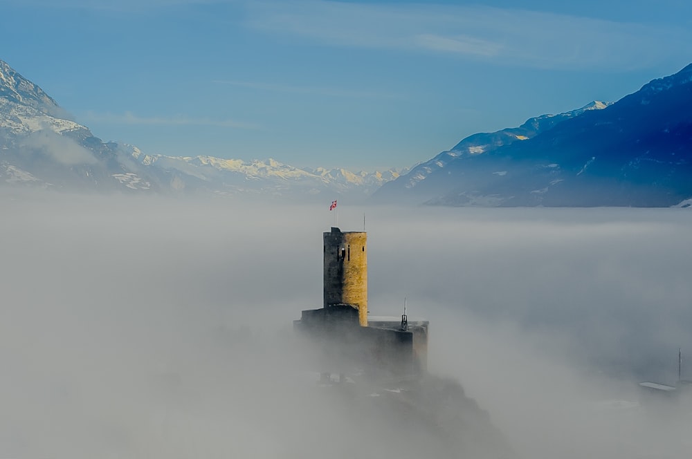 aerial photography of mountains and tower