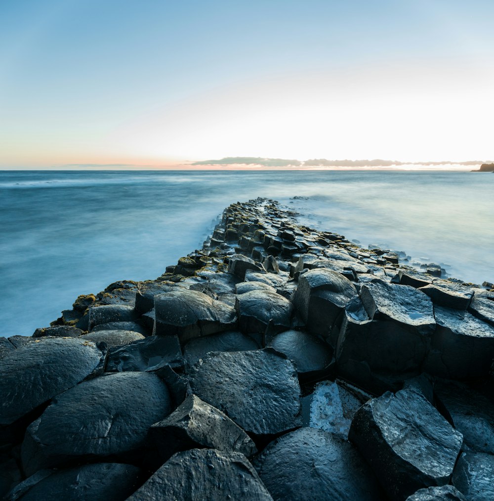 rock formation on body of water