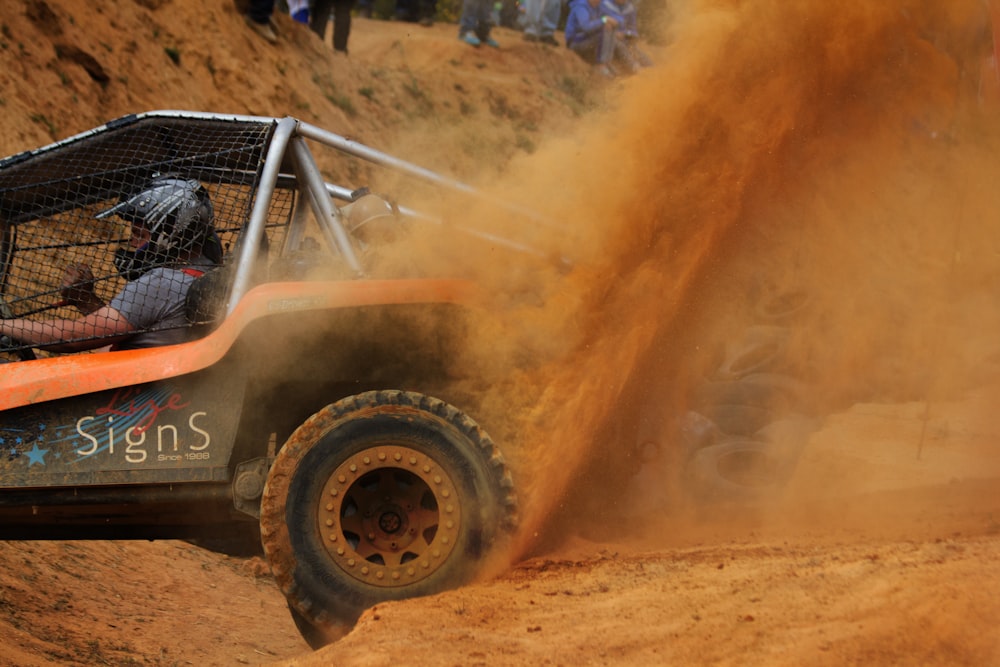 person driving dune buggy