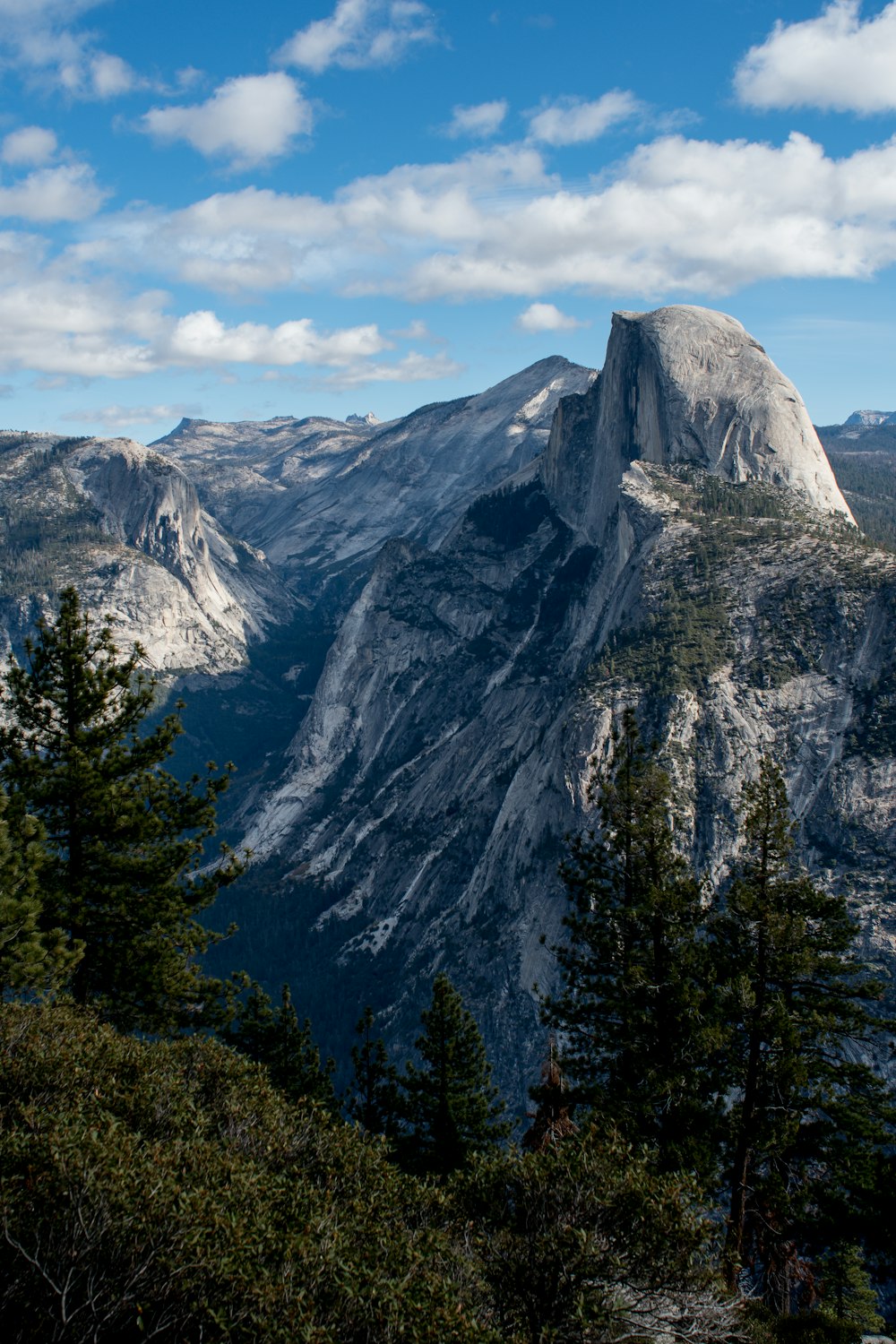 rock peak mountain under gray clouds