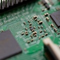 tilt-shift photography of green computer motherboard