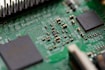 tilt-shift photography of green computer motherboard