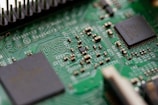 tilt-shift photography of green computer motherboard