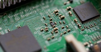 tilt-shift photography of green computer motherboard