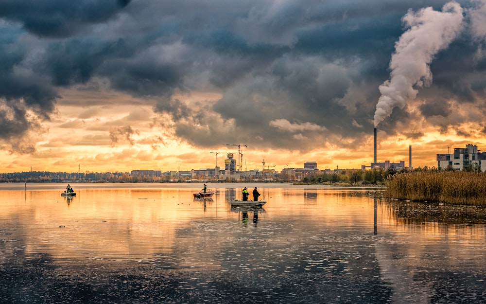 panoramic photo of people riding on boats