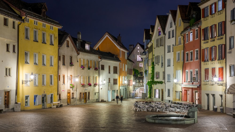 two person walking on street with lights