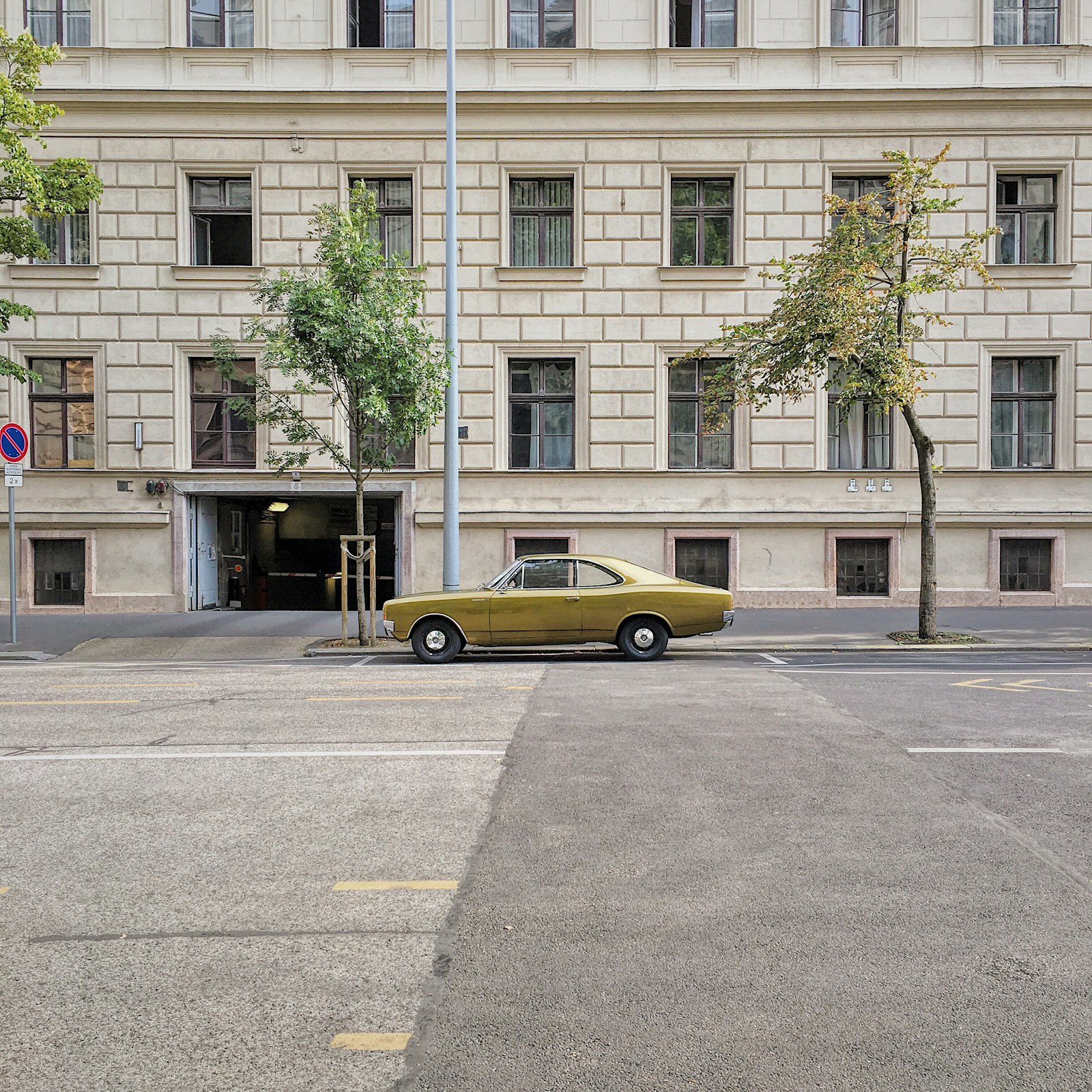 Apple iPhone 6s sample photo. Yellow sedan on concrete photography