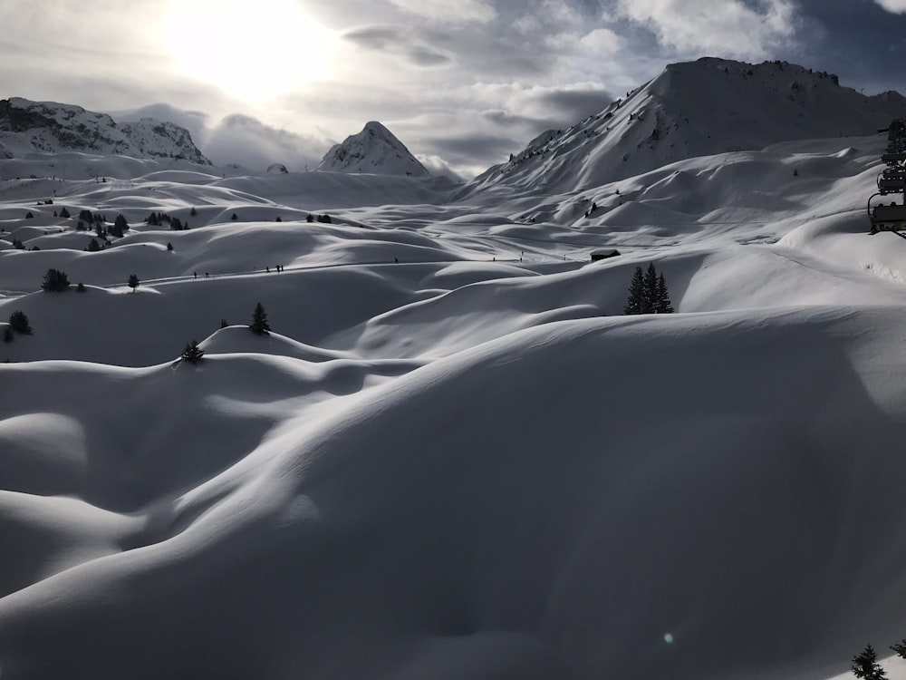 white snow and mountains at daytime