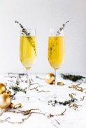 Elegant champagne flutes sparkling with golden bubbles.